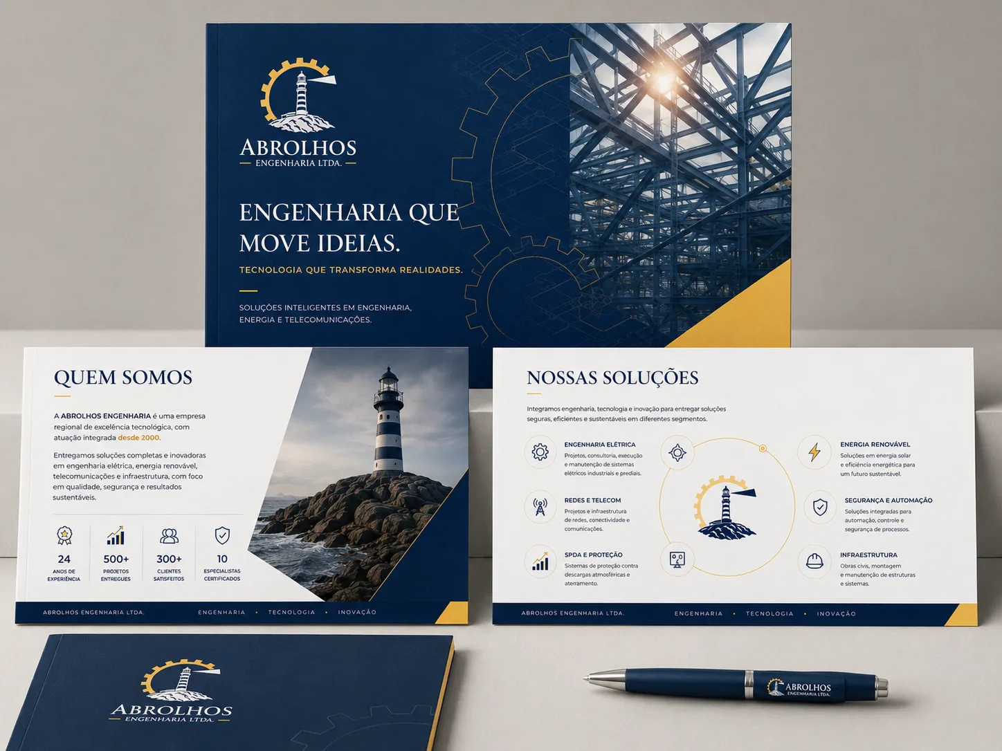 Material institucional impresso da Abrolhos Engenharia: capa com estrutura metálica, página Quem Somos com indicadores de experiência e página Nossas Soluções com seis áreas de atuação